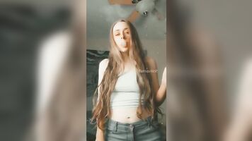 Smoking in Jeans and a Tank Top