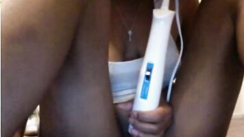 Vibrator on ebony pussy